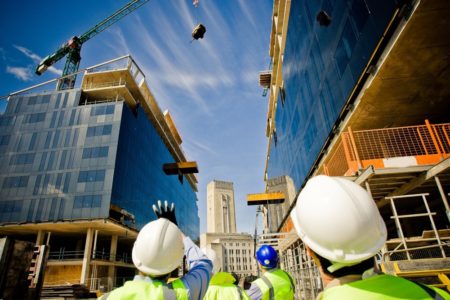 Structures and Buildings Allowances (SBAs) - View of builders wearing hard hats looking up at a building under construction