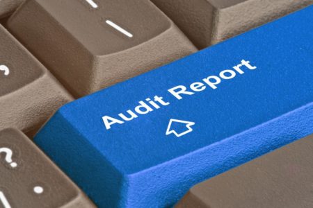 Payment and e-money firms safeguarding audit - keyboard button with 'Audit Report' written on.