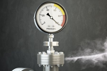 Pressure gauge showing high pressure and releasing a spurt of gas